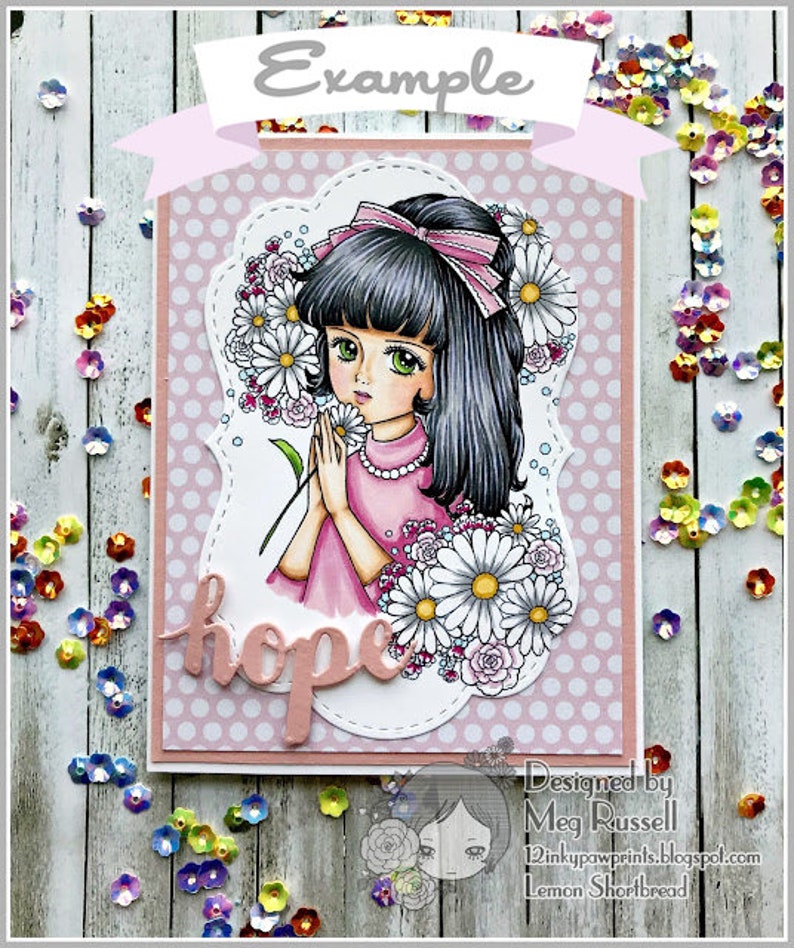 May include: A pink and white card with a girl holding a bouquet of white daisies. The card has a pink polka dot background and the word "hope" written in pink script. The card is designed by Meg Russell and features the text "Lemon Shortbread".