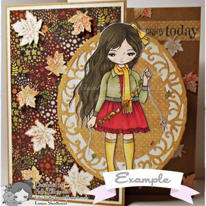 May include: A digital illustration of a girl with long brown hair wearing a red dress and a yellow scarf. She is holding a string of autumn leaves. The background is a brown and gold patterned paper with the text "enjoy today" and "Example".