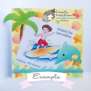 May include: A birthday card with a cartoon illustration of a boy surfing on a wave with a dolphin jumping out of the water. The card has a yellow background with a palm tree, seashells, and starfish. The text on the card reads "Wishing You Good Waves" and "Happy Birthday".