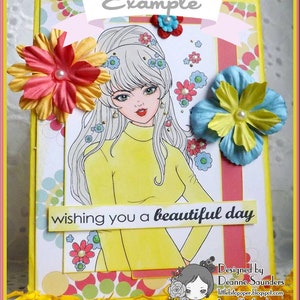 May include: A yellow card with a white border and a colorful background. The card features a cartoon illustration of a woman with long white hair wearing a yellow sweater. The text "wishing you a beautiful day" is printed on the card. The card is decorated with colorful flowers and the text "Example" is printed at the top of the card.