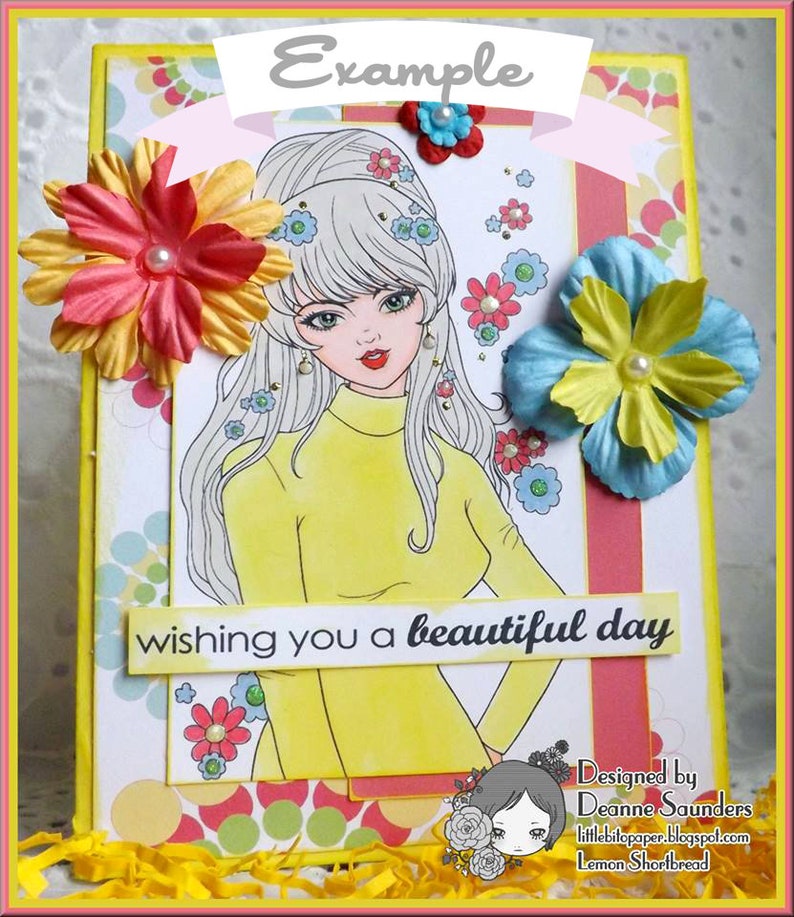May include: A yellow card with a white border and a colorful background. The card features a cartoon illustration of a woman with long white hair wearing a yellow sweater. The text "wishing you a beautiful day" is printed on the card. The card is decorated with colorful flowers and the text "Example" is printed at the top of the card.