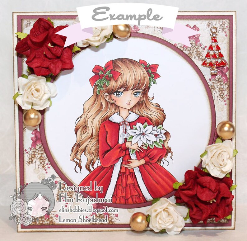 May include: A Christmas card featuring a girl with long blonde hair wearing a red dress and holding a poinsettia. The card is decorated with red and white flowers, gold ornaments, and a small Christmas tree charm.