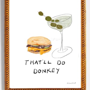 May include: A framed illustration of a burger and a martini glass with olives. The text "That'll do donkey" is written below the image.