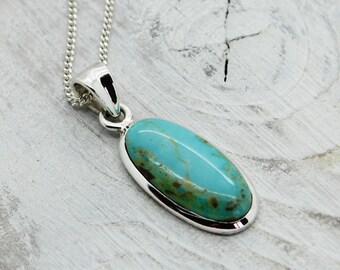 Long oval Turquoise stone pendant natural turquoise stone set on 925 sterling silver handmade quality artisan piece very nice color stone