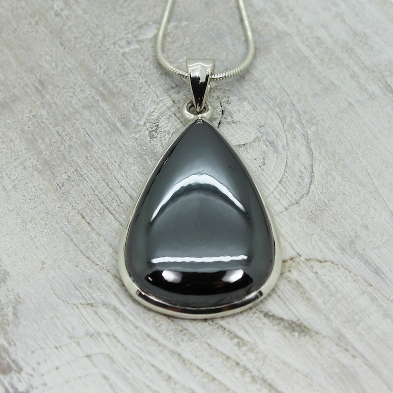 Hematite stone pendant teardrop shape all natural cabochon silver color shiny stone set on sterling silver 925 mount natural quality jewelry
