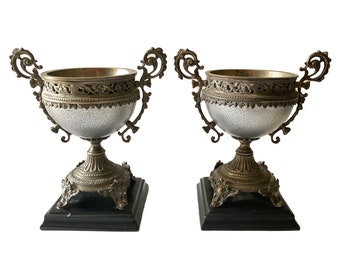 Pair Of Silver Ornate Metal Urns On Black Bases Castilian Imports