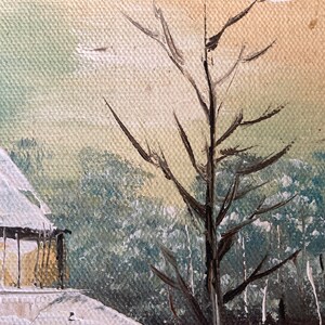 May include: Oil painting of a winter landscape featuring a snow-covered building and bare tree branches. The artwork uses muted tones of white, beige, and blue to depict a serene, cold scene. The painting has a textured canvas.