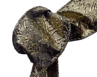 Blackened Gold Lamé Wired Ribbon: Squiggle Pattern, 2.5" x 10 Yards (4 Rolls)