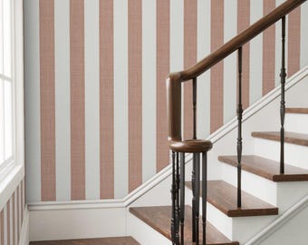 May include: A staircase with white risers and brown wooden steps. The wall features vertical stripes in white and a muted reddish-brown. A dark brown wooden handrail and black spindles complete the design.