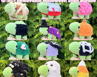 May include: A collection of twelve crochet turtle plushies with removable Halloween-themed shells, including designs like a mummy, witch, pumpkin, spider, ghost, and candy corn. The text reads Land Turtle Dress Up 12-in-1 Removable Halloween Shell Bundle.