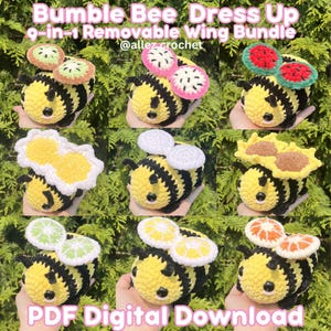 May include: A crochet bumble bee toy with nine interchangeable wing sets featuring fruit and flower designs including kiwi, dragon fruit, watermelon, daisy, sunflower, lime, lemon, and orange. The text reads Bumble Bee Dress Up 9-in-1 Removable Wing Bundle.