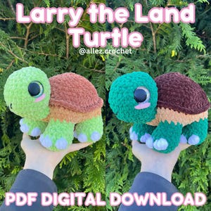 May include: Two crocheted turtle plushies, one green and one teal, with brown and orange shells. The text "Larry the Land Turtle" and "PDF DIGITAL DOWNLOAD" are displayed. The plushies have large black eyes and are held up.