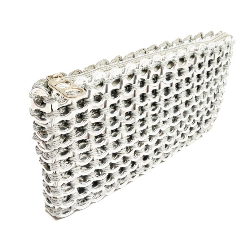 silver clutch purse made from up-cycled aluminum soda top tabs the bag is shiny silver with a zipper on top