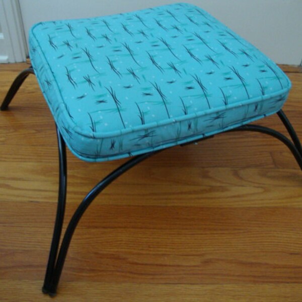 Fab vintage Eames era footstool with aqua print top and tubular legs