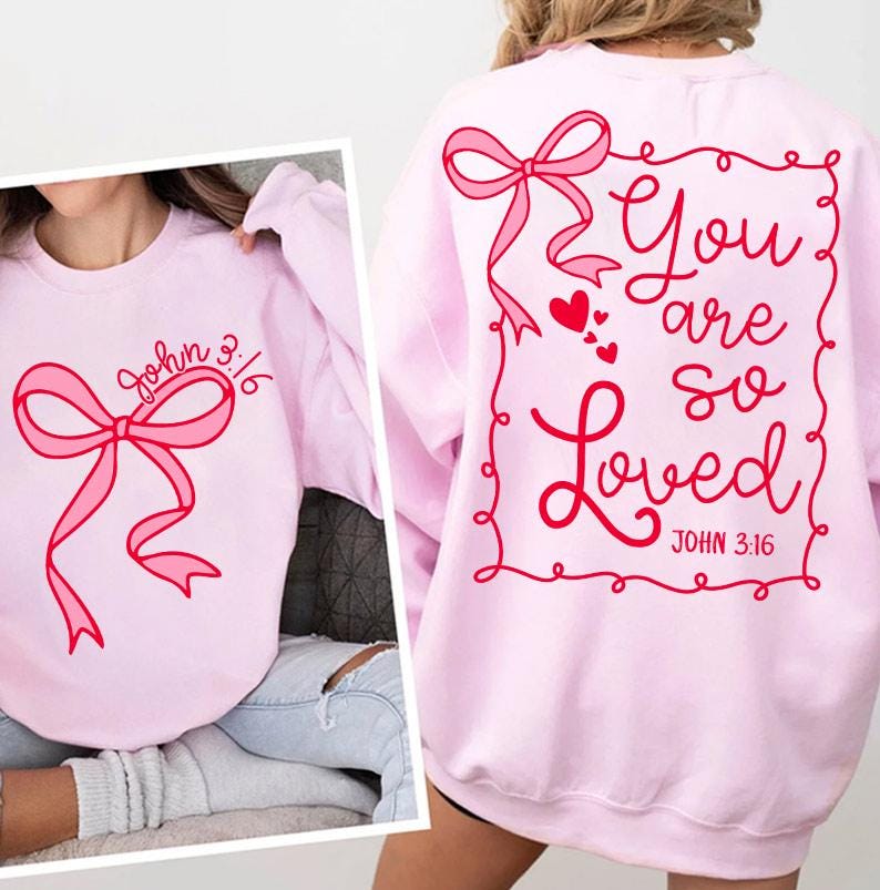 May include: Pink sweatshirt with a pink bow and the text "John 3:16" on the front. The back of the sweatshirt has a pink bow and the text "You are so Loved John 3:16" inside a red frame.