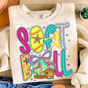 May include: A cream-colored sweatshirt with a colorful graphic design that says "Softball" with a softball, a bat, a glove, and a player in a softball pose.