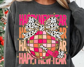 May include: A charcoal grey sweatshirt with a pink and black design featuring a disco ball, a bow, and the text "Happy New Year".