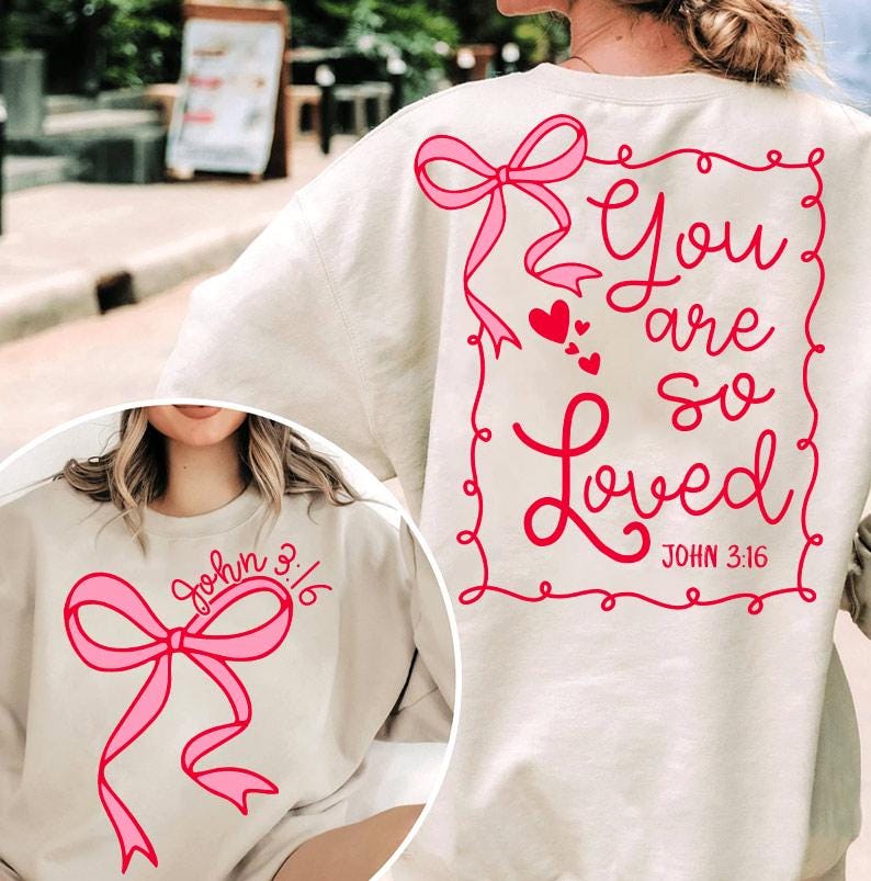 May include: Two cream-colored sweatshirts with pink bows and the text "You are so Loved" and "John 3:16" in red.