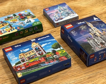 May include: Four different LEGO Disney sets, including a train, a castle, a Frozen scene, and a tropical island. The boxes are all blue and green with the LEGO logo and Disney branding.