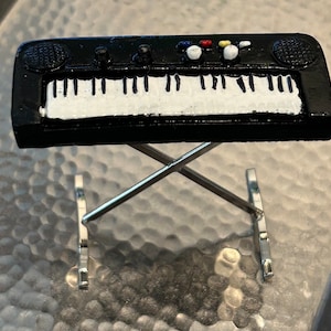 Teclado de piano eléctrico de pie en miniatura