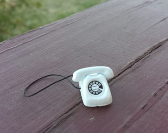 Teléfono de disco en miniatura: el color que usted elija