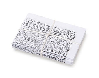 May include: A stack of newspapers tied together with twine. The top newspaper has the headline "Headline News".