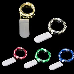May include: String lights in warm white, cool white, red, green, and blue. Each set includes a small white battery pack. The lights are coiled and ready for use, perfect for decorating or crafting projects.