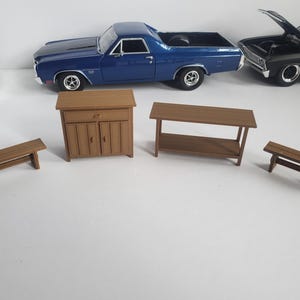 May include: A set of four wooden furniture pieces in brown, including a cabinet with two doors and a drawer, a table with a shelf, and two benches.
