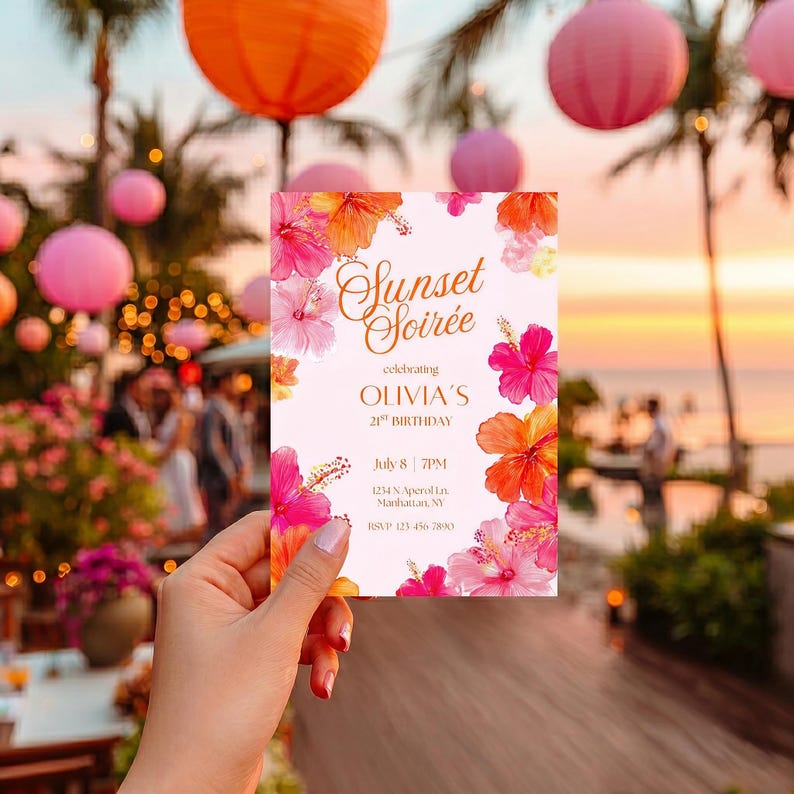 May include: A floral invitation card with the text "Sunset Soir&eacute;e" and details for a 21st birthday celebration. The card features pink and orange hibiscus flowers and is held in front of a blurred outdoor party scene.