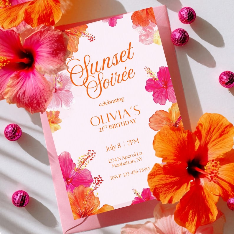 May include: A pink invitation with the text "Sunset Soir&eacute;e" and "OLIVIA'S 21ST BIRTHDAY". The invitation is decorated with orange and pink hibiscus flowers. The RSVP information is included. Pink decorative balls surround the invitation.