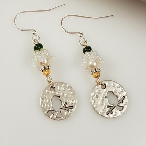 Singing bird and white Lily of the valley flowers earrings