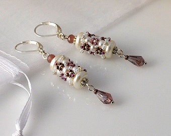 Beadwoven pearl earrings in white and purple