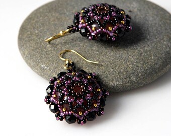 Beadwoven mandala earrings in black and purple