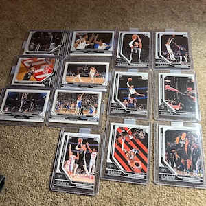 Lote de 13 cartas de novatos diferentes de Panini Instant con impresión corta de Victor Wembanyama