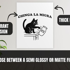 May include: Black and white print featuring a black cat knocking over a jar of ice. The text "CHINGA LA MIGRA" is above the cat. The print is on thick paper with a vibrant design, available in semi-glossy or matte finish.