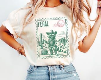 Funny Feral Cowboy Raccoon Graphic Shirt Comfort Colors® Trash Panda Feral Meme Shirts For Women, Funny Unhinged Cozy Racoon Lover Gifts