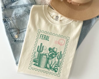 Funny Feral Cowboy Raccoon Graphic Shirt Comfort Colors® Trash Panda Feral Meme Shirts For Women, Funny Unhinged Cozy Racoon Lover Gifts