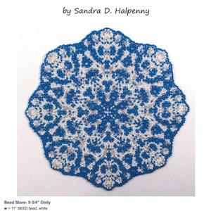 May include: A white snowflake lace doily pattern made with seed beads in white, silver, and blue. The doily is 5 3/4 inches in diameter. The pattern is by Sandra D. Halpenny.