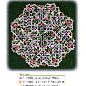 May include: A beaded doily pattern with a floral design. The doily is made with seed beads in shades of pink, green, white, and gold. The pattern is called "Spring Coaster Doily" and is by Sandra D. Halpenny.