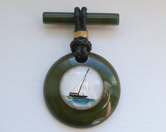 Vintage Green Bakelite Nautical Pin w Reverse Painted Sailboat Domed Center