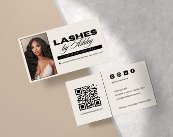 May include: A business card for a lash technician named Ashley. The card features a photo of Ashley, her business name, and contact information. The back of the card includes a QR code, social media handles, and business hours.