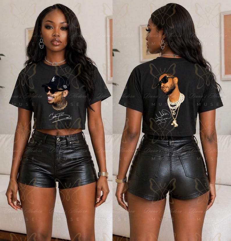May include: A black cropped t-shirt featuring a graphic print of a person wearing a baseball cap, sunglasses, and a chain necklace, paired with black leather-like shorts. The shirt displays a signature graphic below the portrait.