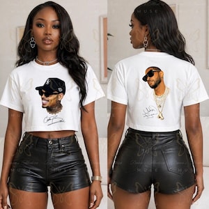 May include: A white short-sleeved crop top featuring a graphic print of a person wearing a black baseball cap and sunglasses on the front, and a graphic print of a person wearing sunglasses and layered necklaces on the back, paired with black shorts.