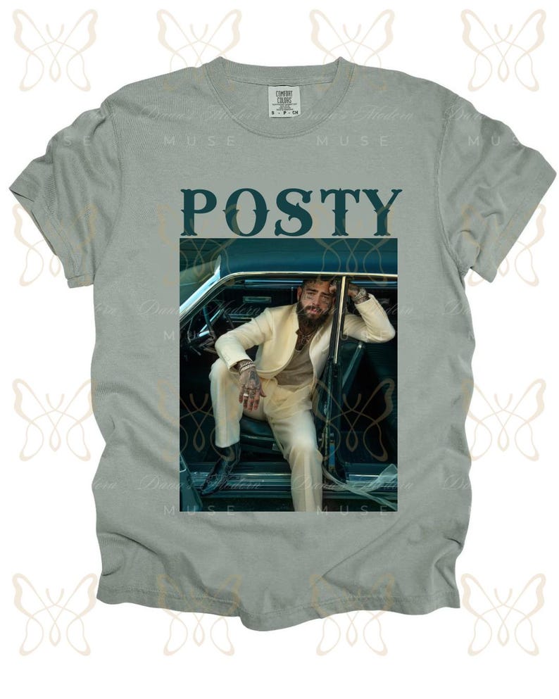 May include: A light gray t-shirt with a graphic print of a man in a white suit sitting in a vintage car. The text "POSTY" is printed in dark blue letters above the image.