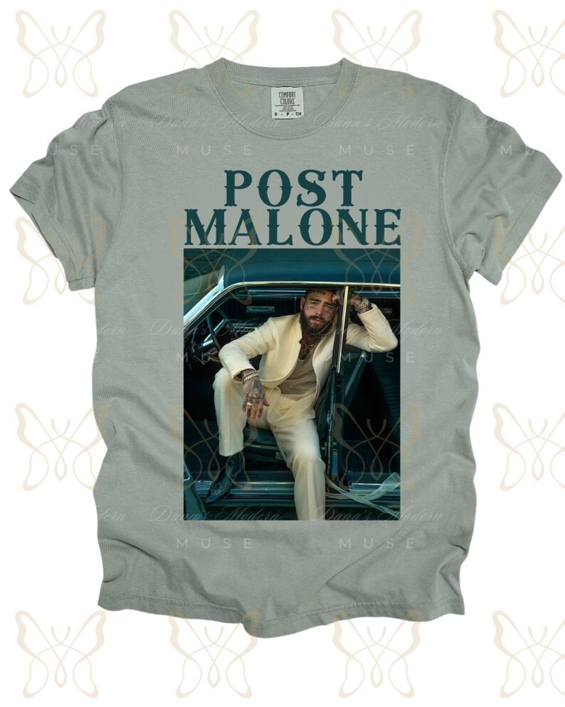 May include: A light gray t-shirt with a graphic print of Post Malone sitting in a car. The text "Post Malone" is printed in dark blue letters on the shirt.