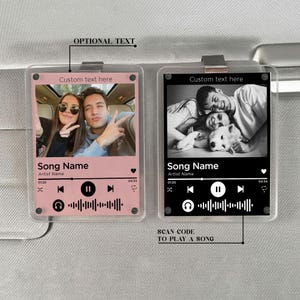 May include: Two clear acrylic car accessories, each featuring a photo and a music player interface design. One is pink with a color photo, the other is black and white. Both have the text "Custom text here" and "Song Name".