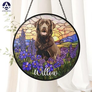 May include: A stained glass window hanging with a brown Labrador Retriever standing in a field of purple flowers. The dog is looking at the viewer and the text "Willow" is at the bottom of the image.