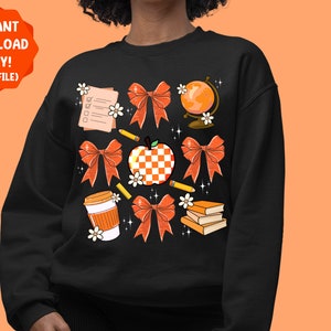 May include: Black sweatshirt with an orange and white apple, a globe, a checklist, pencils, books, and orange bows. The text "INSTANT DOWNLOAD ONLY! (PNG FILE)" is at the top of the image.