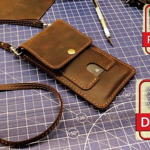 May include: A brown leather phone case with a flap and a strap. The case has a pocket for cards and a snap closure. The case is on a blue cutting mat with a ruler marked in degrees. The image also includes two icons, one for a PDF file and one for a DXF file.