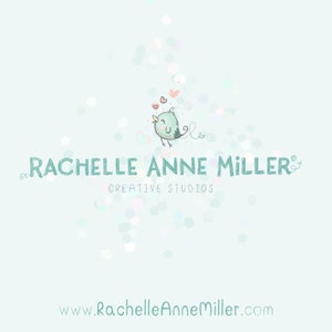 May include: A light blue logo with a green bird singing and hearts floating above it. The text "Rachelle Anne Miller" is in a whimsical font with a decorative flourish. The text "Creative Studios" is below the name. The website address "www.RachelleAnneMiller.com" is at the bottom of the logo.